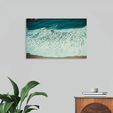  "Pacific Afternoon II" by Nathan Larson is a breathtaking aerial photograph that captures the serene beauty of the Pacific Ocean. The deep turquoise water, punctuated by rolling white waves, creates a mesmerizing and calming scene. The image evokes a sense of peace and tranquility, inviting the viewer to imagine themselves relaxing on a sandy beach and soaking up the sun. This limited edition print is perfect for adding a touch of coastal serenity to any home or office.