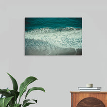  "Pacific Afternoon III" by Nathan Larson is a breathtaking aerial photograph that captures the serene beauty of the Pacific Ocean. The deep turquoise water, punctuated by rolling white waves, creates a mesmerizing and calming scene. The image evokes a sense of peace and tranquility, inviting the viewer to imagine themselves relaxing on a sandy beach and soaking up the sun. This limited edition print is perfect for adding a touch of coastal serenity to any home or office.