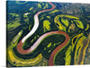 Immerse yourself in the breathtaking beauty of nature with this exquisite print, “NASA Scientists are Flying over Alaska and Canada.” The artwork captures an aerial view of a meandering river, its waters painting a serpentine path through lush green landscapes.