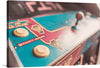 This stunning close-up photograph of Ms. Pacman arcade cabinet with buttons and a joystick captures the excitement and anticipation of embarking on a new adventure. The console is shown in all its sleek and futuristic glory, with its illuminated buttons and gleaming surfaces. The joystick is poised, ready to take the player on a journey to new and exciting worlds.