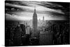 Experience the grandeur of New York City with this stunning print of the “Empire State Building”. This black and white photograph captures the iconic skyscraper reaching towards the sky, a testament to human ingenuity and architectural brilliance.
