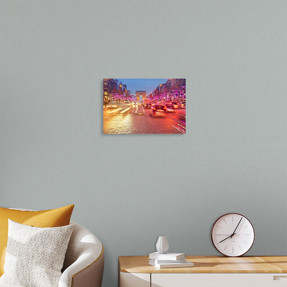 "Night view of Arc de Triomphe with vehicle light trails effect"