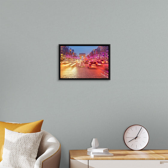 "Night view of Arc de Triomphe with vehicle light trails effect"