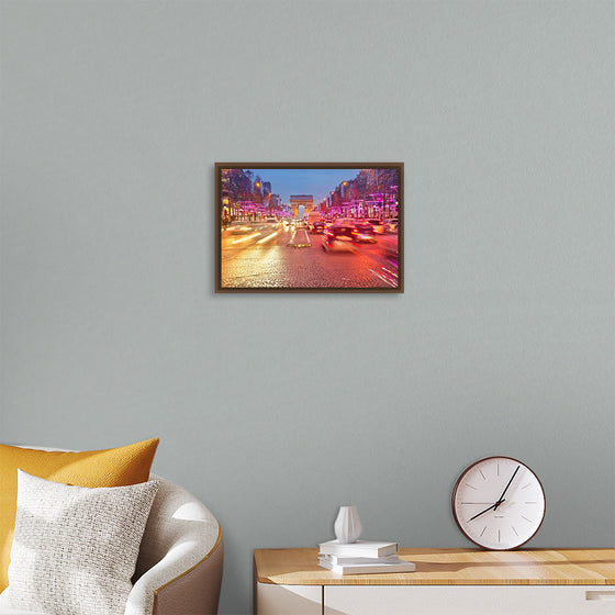 "Night view of Arc de Triomphe with vehicle light trails effect"