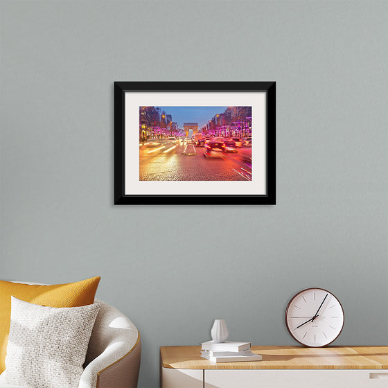 "Night view of Arc de Triomphe with vehicle light trails effect"