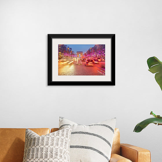 "Night view of Arc de Triomphe with vehicle light trails effect"