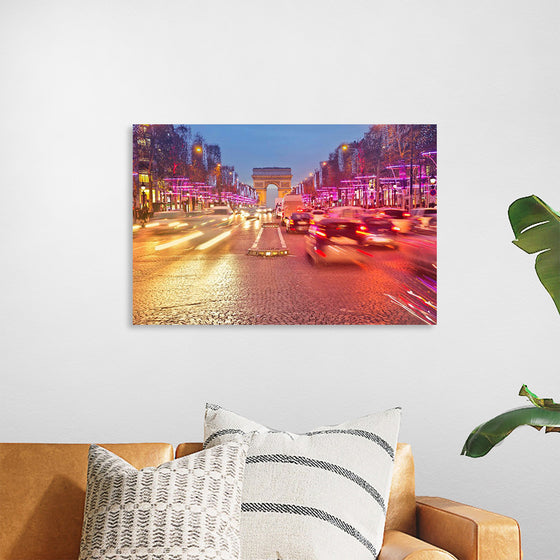 "Night view of Arc de Triomphe with vehicle light trails effect"