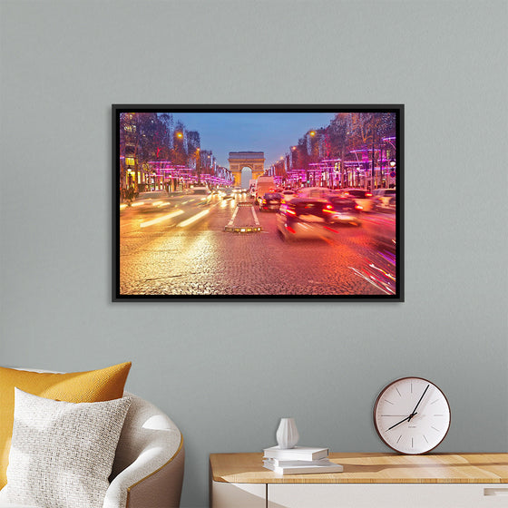 "Night view of Arc de Triomphe with vehicle light trails effect"