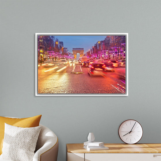 "Night view of Arc de Triomphe with vehicle light trails effect"