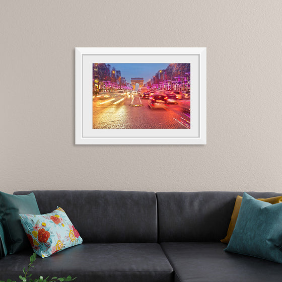 "Night view of Arc de Triomphe with vehicle light trails effect"