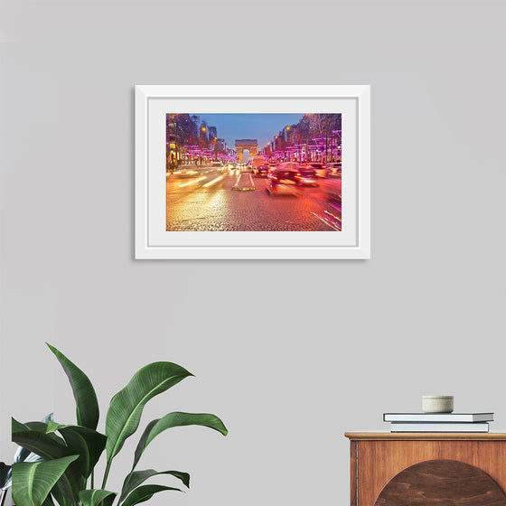 "Night view of Arc de Triomphe with vehicle light trails effect"