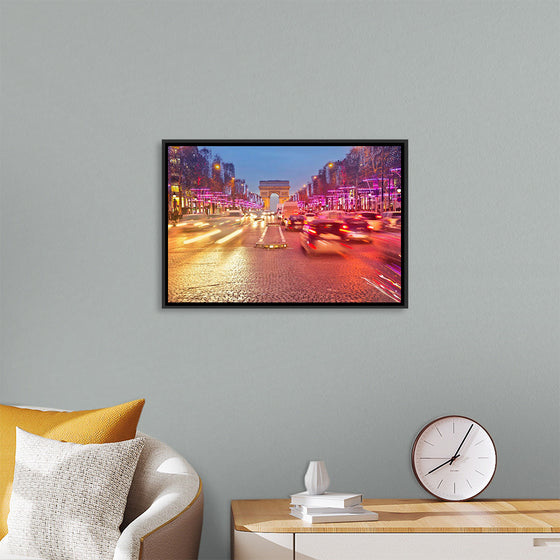 "Night view of Arc de Triomphe with vehicle light trails effect"