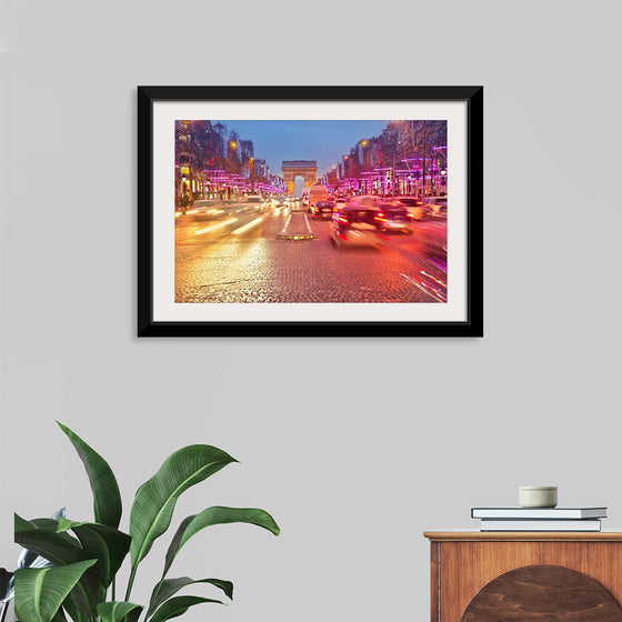 "Night view of Arc de Triomphe with vehicle light trails effect"