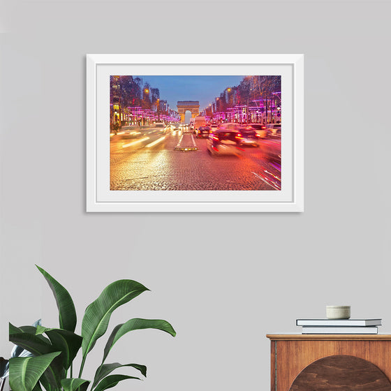 "Night view of Arc de Triomphe with vehicle light trails effect"