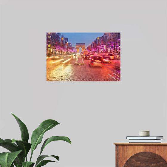 "Night view of Arc de Triomphe with vehicle light trails effect"