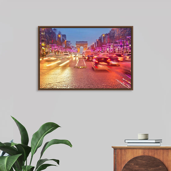 "Night view of Arc de Triomphe with vehicle light trails effect"