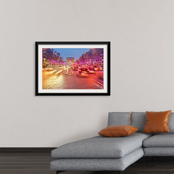 "Night view of Arc de Triomphe with vehicle light trails effect"