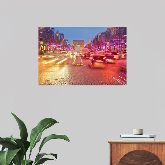 "Night view of Arc de Triomphe with vehicle light trails effect"