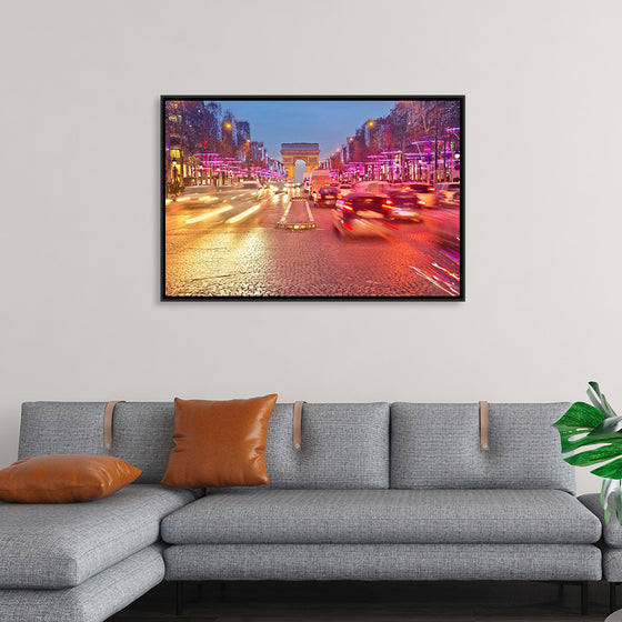 "Night view of Arc de Triomphe with vehicle light trails effect"