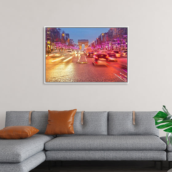 "Night view of Arc de Triomphe with vehicle light trails effect"