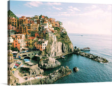  Immerse yourself in the enchanting allure of “Manarola, Italy” with this exquisite art print. Every glance brings you into the serene world of colorful houses perched harmoniously upon rugged cliffs, overlooking the tranquil waters of the Italian Riviera. The vibrant hues and intricate details capture the essence of this iconic coastal village, making it a captivating addition to any space. 