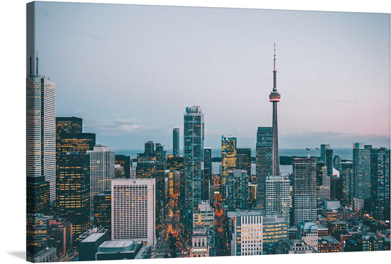 This artwork captures the mesmerizing allure of a cityscape at dusk. The towering architectural marvels kissed by the setting sun, and the iconic skyline punctuated by illuminated windows create a symphony of light and shadow. The prominent CN Tower stands amidst the buildings, its spire piercing into the soft hues of twilight. This print is not just a visual spectacle but an experience, inviting viewers into a world where modernity and elegance coexist seamlessly.