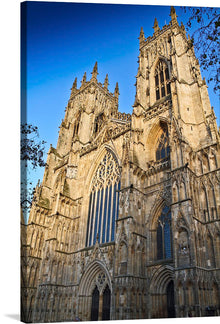  “York Minster” by Michael D Beckwith invites you to a world of architectural grandeur and celestial light. This exquisite print captures the iconic Gothic cathedral bathed in soft, golden hues—the sun illuminating its majestic façade and intricate details. Every stone and stained glass window tells a story of history, artistry, and spirituality. 