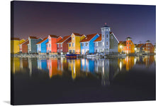  Immerse yourself in the serene beauty of this exquisite print, capturing a tranquil night at a picturesque harbor. The artwork illuminates the vibrant, multicolored facades of charming houses that line the peaceful waters, reflecting an array of colors that dance on the surface. A lighthouse stands sentinel, its soft glow adding to the magical atmosphere. Stars twinkle in the clear night sky, casting their gentle light upon this idyllic scene.