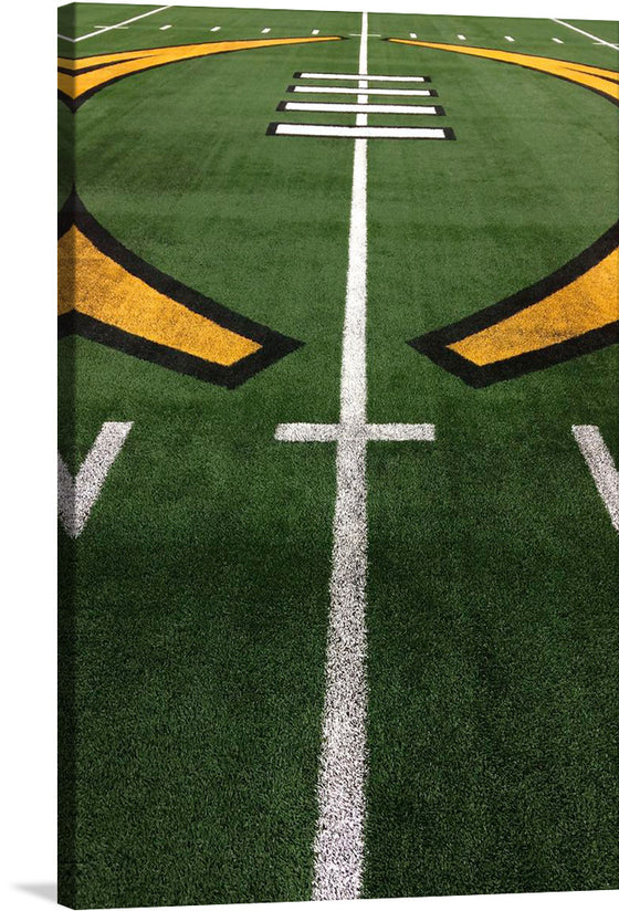 The image is a photo realistic representation of an American football grass field. The image is taken from a low angle, looking up at the field. The field is green with white and yellow lines. The lines form a symmetrical pattern, with the center line being the longest.