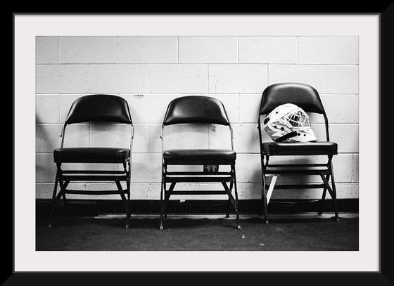 "A Soldier’s Helmet Rests on a Chair"