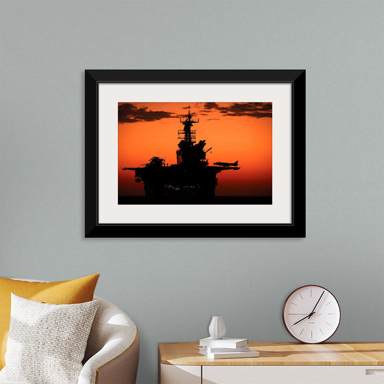 "The setting sun silhouettes the amphibious assault ship USS Makin Island", Gunnery Sgt. Scott Dunn