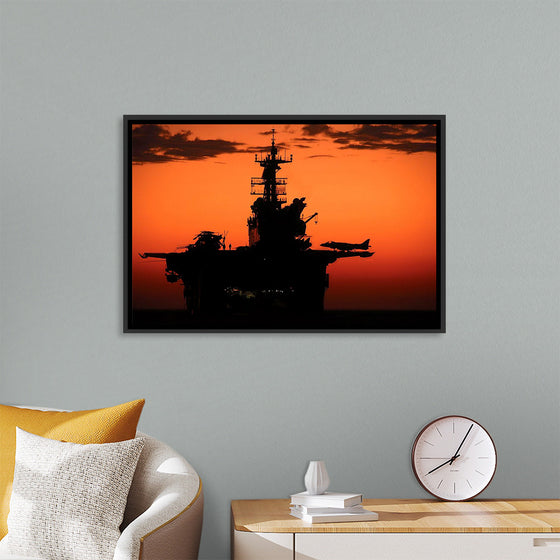 "The setting sun silhouettes the amphibious assault ship USS Makin Island", Gunnery Sgt. Scott Dunn