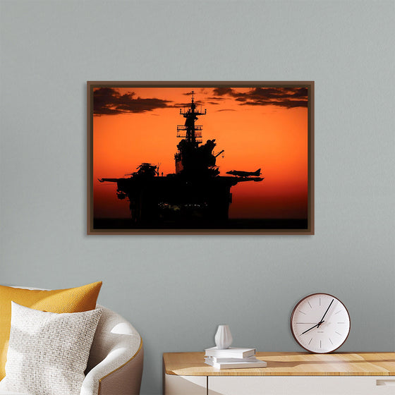 "The setting sun silhouettes the amphibious assault ship USS Makin Island", Gunnery Sgt. Scott Dunn