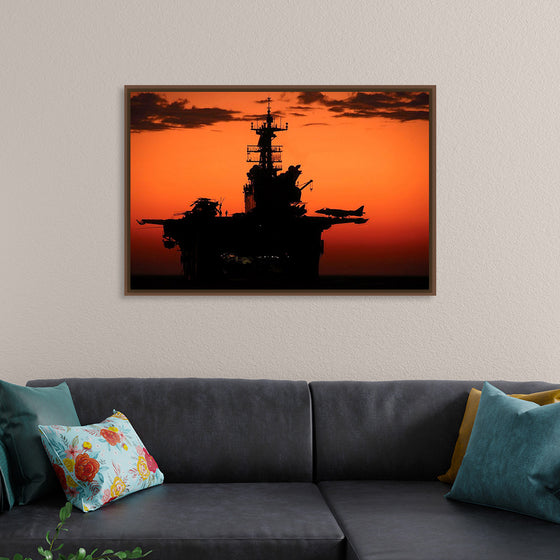 "The setting sun silhouettes the amphibious assault ship USS Makin Island", Gunnery Sgt. Scott Dunn