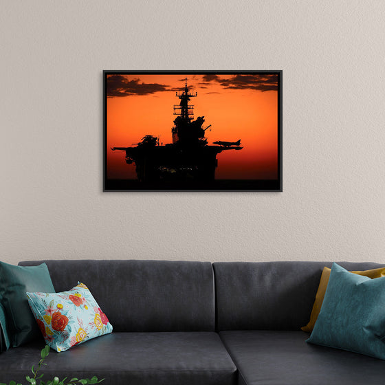 "The setting sun silhouettes the amphibious assault ship USS Makin Island", Gunnery Sgt. Scott Dunn