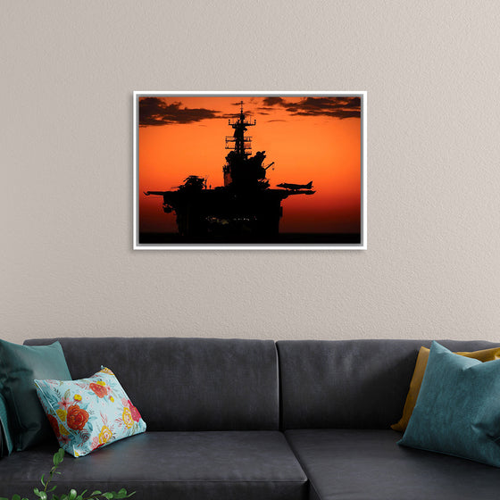 "The setting sun silhouettes the amphibious assault ship USS Makin Island", Gunnery Sgt. Scott Dunn