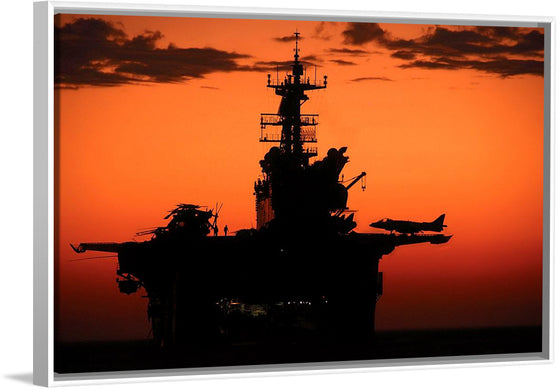 "The setting sun silhouettes the amphibious assault ship USS Makin Island", Gunnery Sgt. Scott Dunn