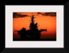 "The setting sun silhouettes the amphibious assault ship USS Makin Island", Gunnery Sgt. Scott Dunn