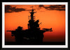 "The setting sun silhouettes the amphibious assault ship USS Makin Island", Gunnery Sgt. Scott Dunn