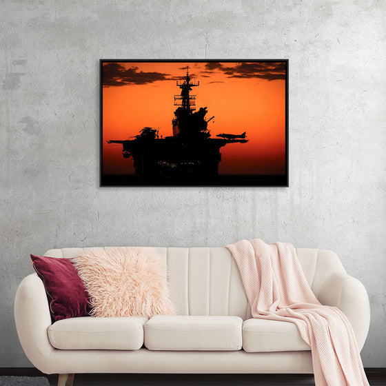 "The setting sun silhouettes the amphibious assault ship USS Makin Island", Gunnery Sgt. Scott Dunn