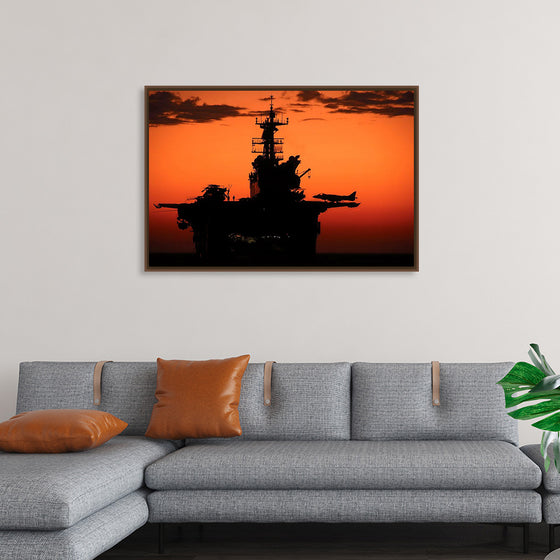 "The setting sun silhouettes the amphibious assault ship USS Makin Island", Gunnery Sgt. Scott Dunn