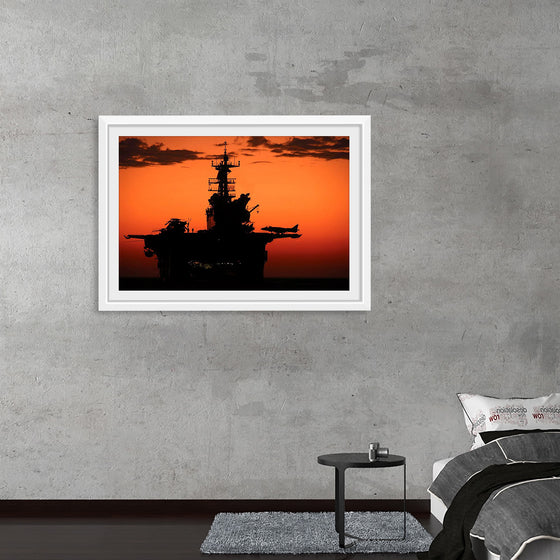 "The setting sun silhouettes the amphibious assault ship USS Makin Island", Gunnery Sgt. Scott Dunn