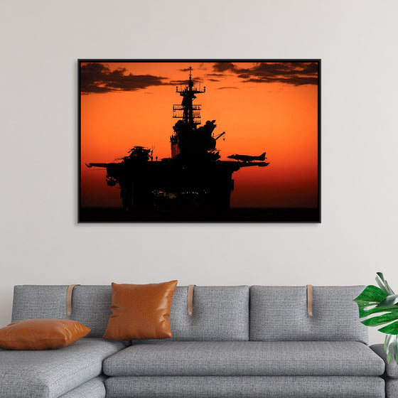 "The setting sun silhouettes the amphibious assault ship USS Makin Island", Gunnery Sgt. Scott Dunn