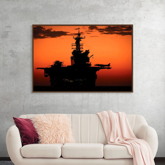 "The setting sun silhouettes the amphibious assault ship USS Makin Island", Gunnery Sgt. Scott Dunn