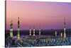 The Prophet's Mosque or Mosque of the Prophet (Al Masjid an Nabawi) is the second mosque built by the Islamic prophet Muhammad in Medina, after that of Quba, as well as the second largest mosque and holiest site in Islam, after the Masjid al-Haram in Mecca, in the Saudi region of the Hejaz. The mosque is located at the heart of Medina and is a major site of pilgrimage that falls under the purview of the Custodian of the Two Holy Mosques.