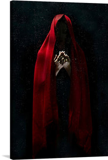  “Man in Red Cloak” is a mesmerizing artwork that captures the essence of mystery and introspection. The central figure, shrouded in a vibrant red cloak against a dark, star-speckled backdrop, evokes an air of mystique. The intricate interplay of light and shadow illuminates the delicate hands that are clasped together as if in prayer or contemplation. 