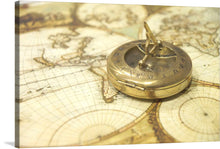  Embark on a journey of discovery with this exquisite print. The allure of exploration is captured in stunning detail, featuring a vintage compass resting upon an intricately detailed map. The golden hue of the compass, rich with the patina of bygone adventures, contrasts beautifully with the sepia tones of the aged map.