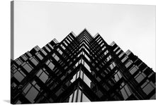  “The Edges of a Wavy Skyscraper Facade in Black and White” by Paulina Jadeszko invites you into a mesmerizing architectural dance. In this striking photograph, the skyscraper’s sinuous edges defy convention, creating a visual symphony against the canvas of the sky. The monochromatic palette amplifies the contrast, emphasizing every curve and angle. 