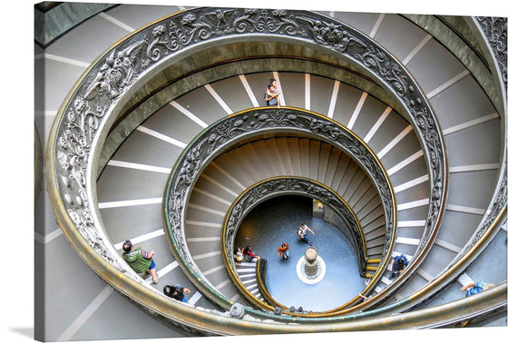 Immerse yourself in the mesmerizing allure of “Looking Down a Massive Spiral Staircase.” This exquisite print captures the architectural elegance and human interaction within a grand, spiraling descent. Every curve, every detail, is a testament to the intricate design that draws the eye downward in an endless dance of form and function.