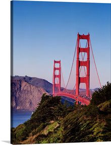 “Golden Gate Bridge, San Francisco, USA” by Carol M. Highsmith captures the iconic landmark in all its grandeur. The print immortalizes the bridge’s majestic red towers soaring above the tranquil waters of San Francisco Bay, set against a backdrop of rolling hills and a serene sky.